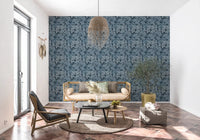 Warm Living nook finished with Indigo Botanical Monstera Leaves Wallpaper