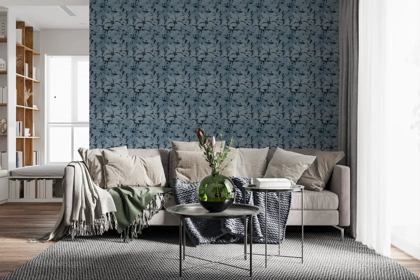 Dark bed backdrop with Indigo Botanical Monstera Leaves Wallpaper in a calm Livning room 