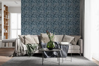 Dark bed backdrop with Indigo Botanical Monstera Leaves Wallpaper in a calm Livning room 