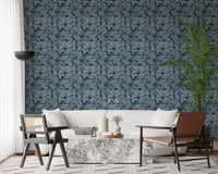 Indigo Botanical Monstera Leaves Wallpaper behind a bath in a modern Living room 