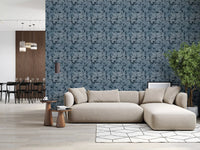 Indigo Botanical Monstera Leaves Wallpaper framing a soft neutral living room