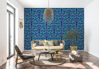 Blue botanical wall mural featuring vibrant leaf patterns for a bedroom.
