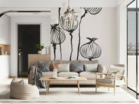 Sofa corner lifted by Ink Poppy Pods wall mural in a refined monochrome setting