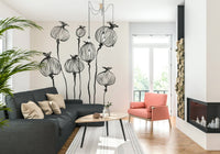 Bright sitting room framed by Ink Poppy Pods wall mural and light natural accents