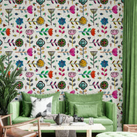 Elegant wall design of white flowers with delicate bug accents.

