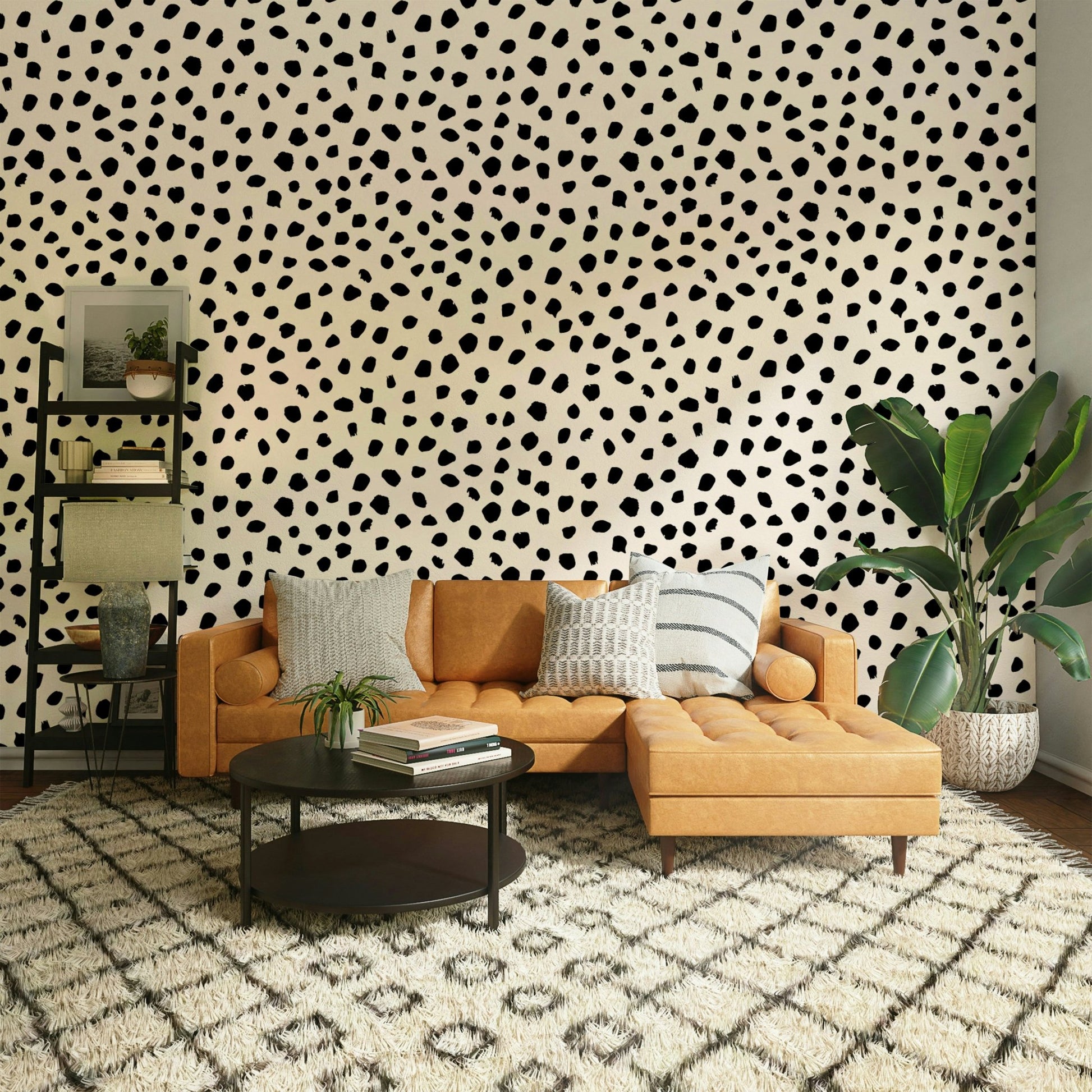 A bedroom with a chic black spot design

