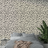 A modern office decorated with a black spots mural

