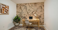 Jungle Escapade wallpaper for walls behind a stylish armchair.