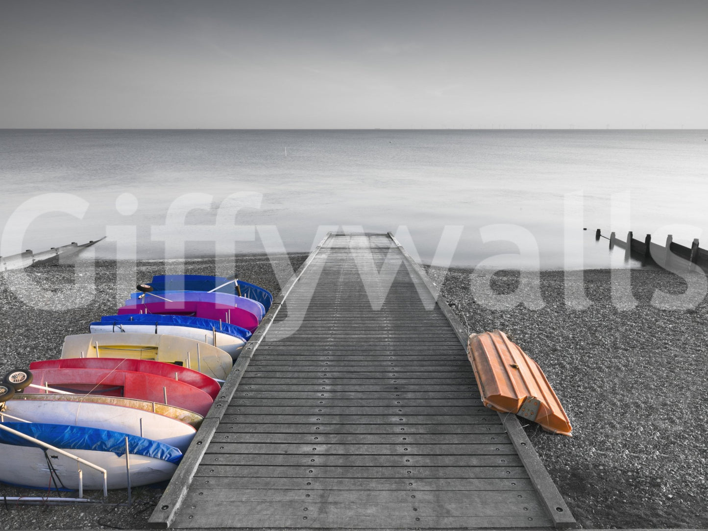 Colorful kayaks beside pier in Kayaks on Pier Wall Mural coastal scene