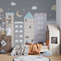 Whimsical town wallpaper for kids' room decor.