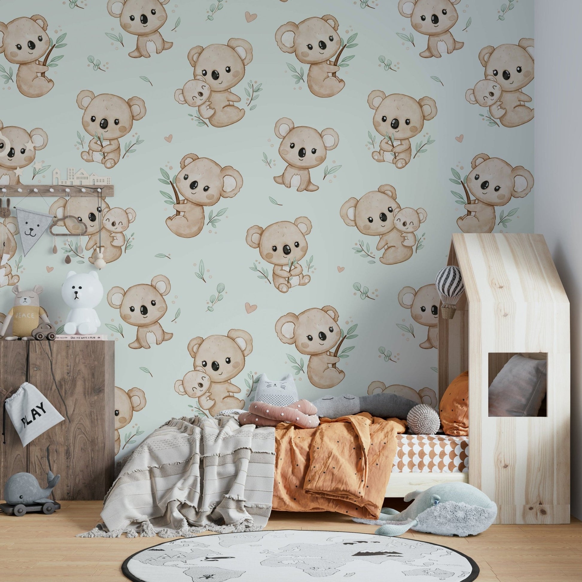 Adorable koalas with eucalyptus on soft mint

