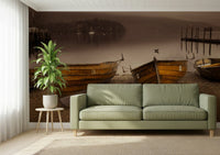 Nautical wall mural of vintage boats tied up near a jetty and water.