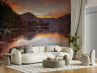 Scenic mountain wallpaper featuring soft morning light and calm water.