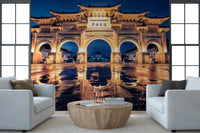 Ornate gate mural with blue sky background.