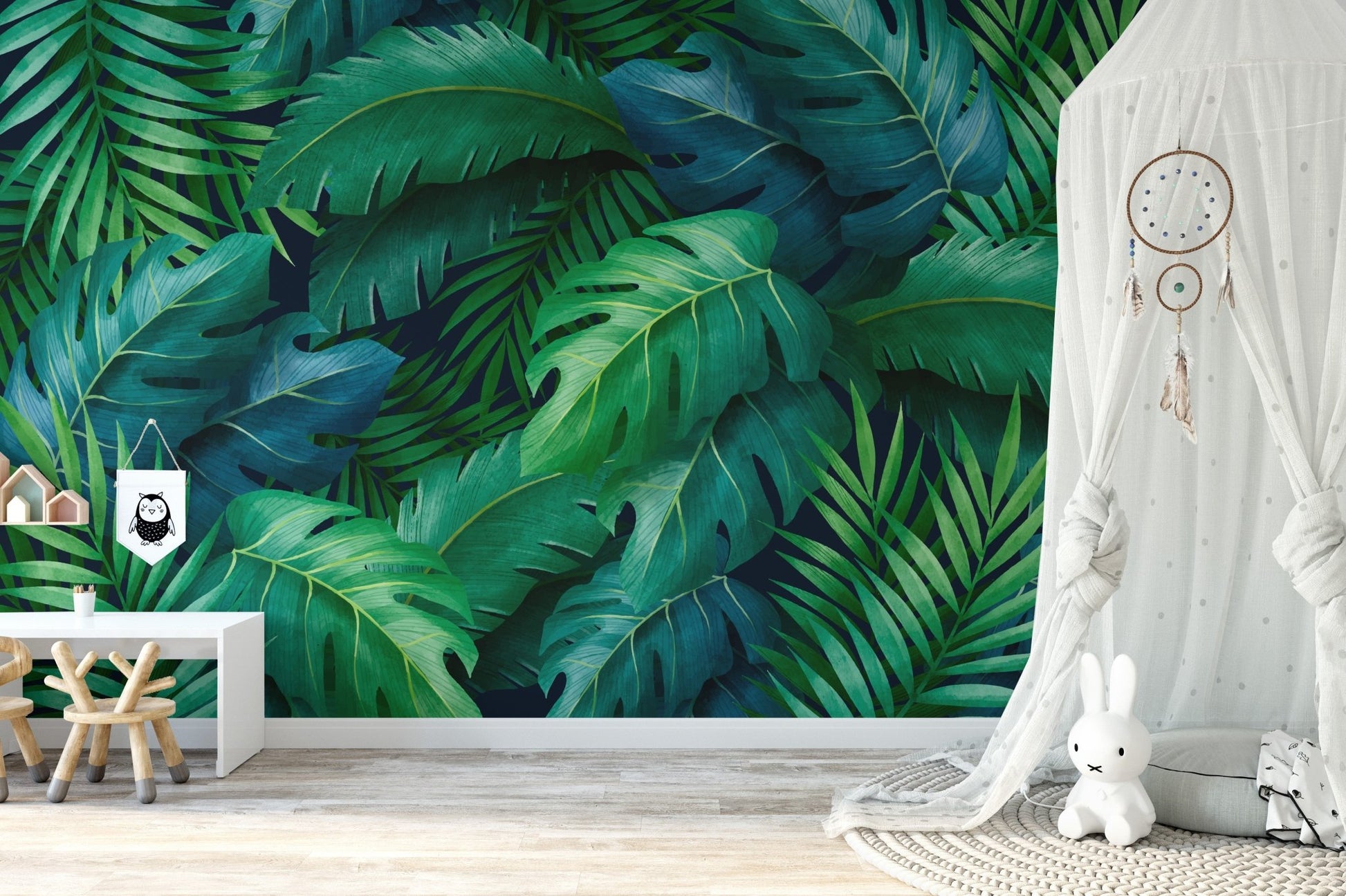 Lush greenery wallpaper mural with bold tropical leaf design.