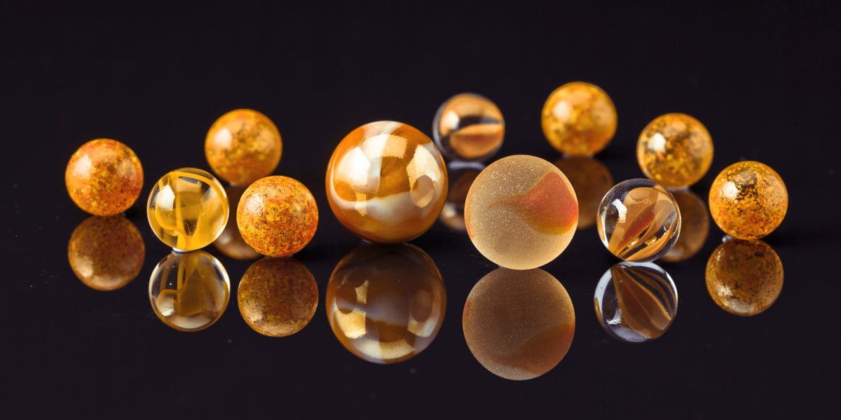 Marbles on black Wall Mural