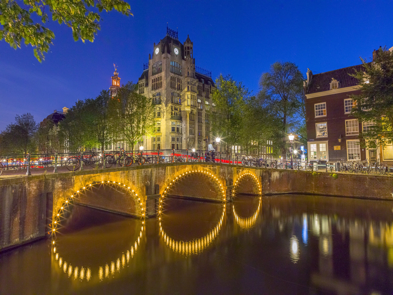 Canal through Amsterdam city Wall Mural