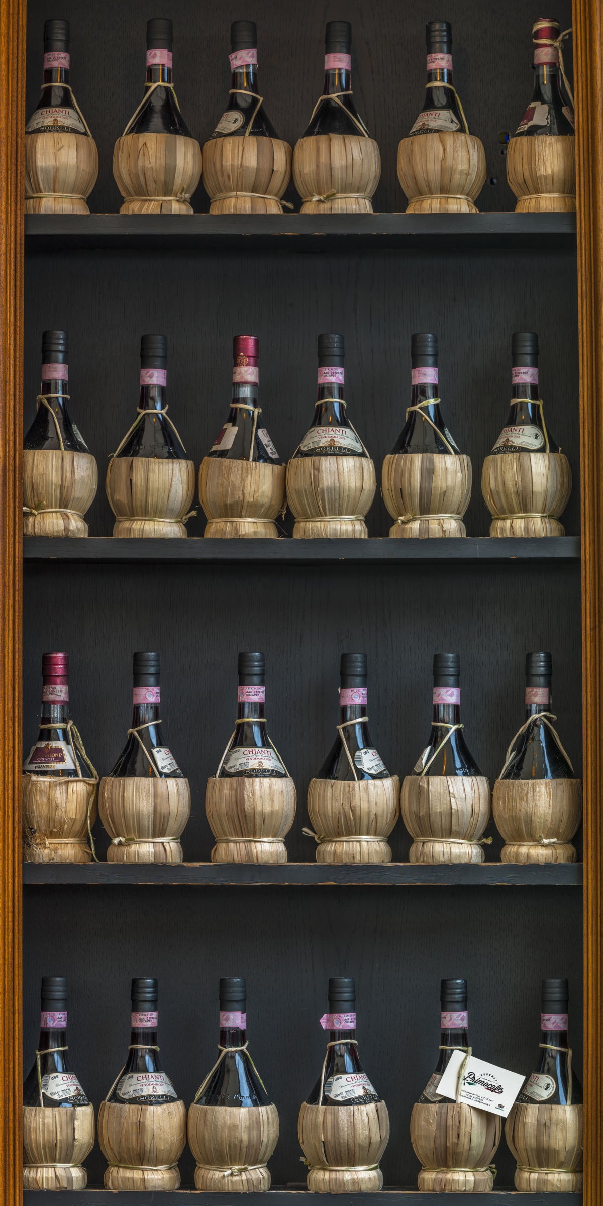 Tuscan Chianti Bottles in Straw Fiaschi Wall Mural in your room — zoomed