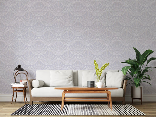 Living room setup with Lavender Lines Wallpaper behind a light sofa and wooden table