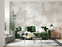 An artistic lush foliage mural on minimalist wallpaper.