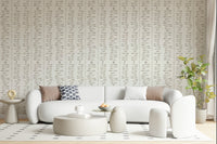Bohemian aesthetic leaf branch wall mural cream hues.