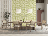Leaves Play Spring Green Wallpaper behind a light wood console table., GD6218