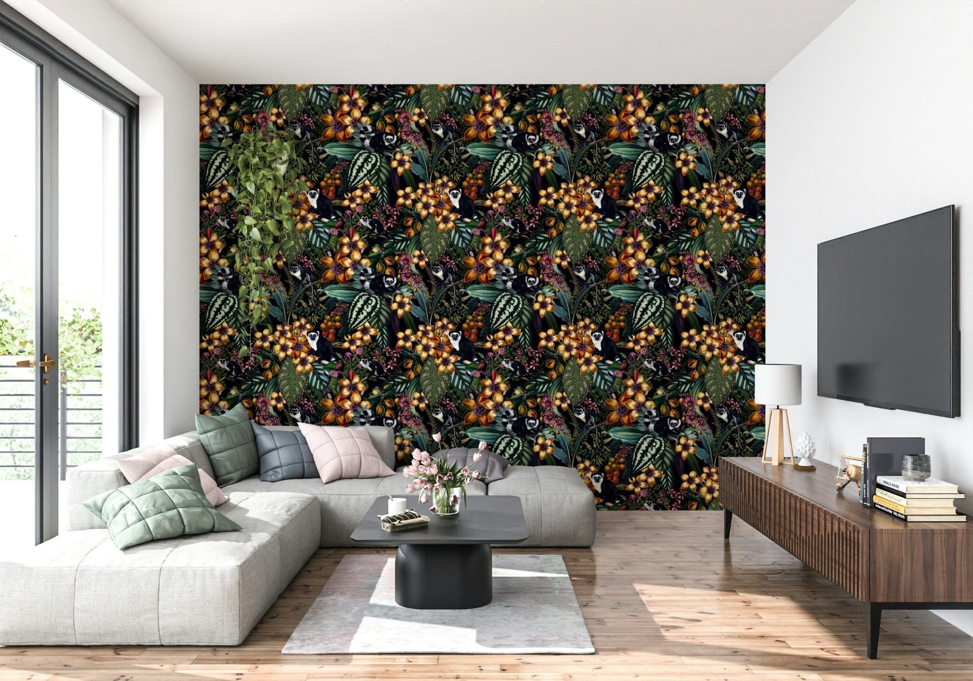 Exotic wildlife wallpaper featuring lemurs hiding among large green leaves.