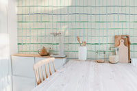 Artistic handdrawn lines wall design in green tones
