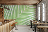 A calming green leaf design wallpaper mural that defines a space.

