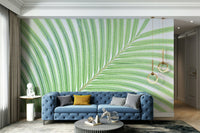An artistic lime leaf mural on minimalist wallpaper.

