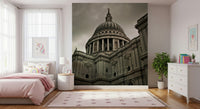 Panoramic wall mural of a riverside city skyline in daylight.