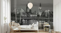 London's Monochrome Majesty Wall Mural behind a grey sofa in a modern lounge.