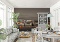 Modern office space with a moody urban skyline mural on a large feature wall.