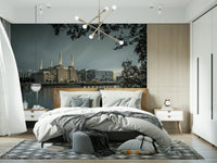 Urban landscape wall mural used as a backdrop for a modern home office desk.
