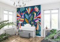 Detailed floral and bird wallpaper for a cozy reading nook.