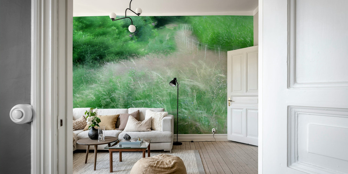 An abstract wall mural of a blurry, lush green pathway.