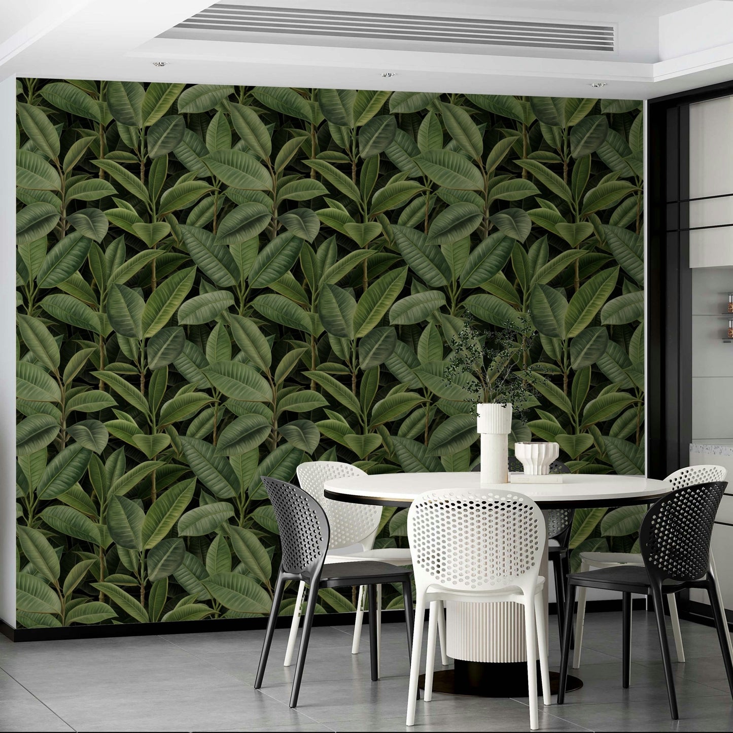 An angled shot of a wall with lush foliage wallpaper

