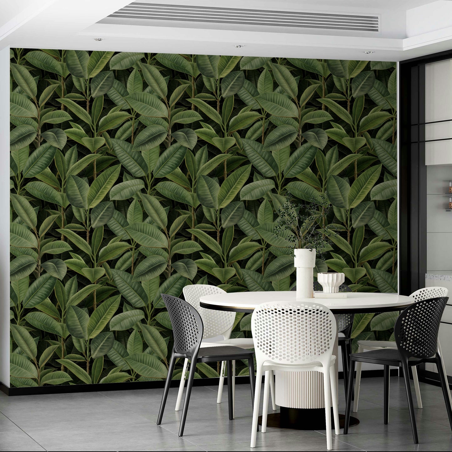 An angled shot of a wall with lush foliage wallpaper

