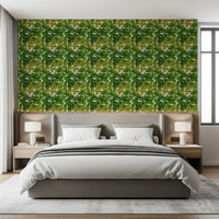 Lush Leaf Canopy Monstera Leaves Wallpaper above a calm upholstered bedroom 