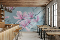 A wall mural of a painting of magnolia blossoms.

