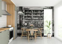 A black and white photograph of an elegant bar.

