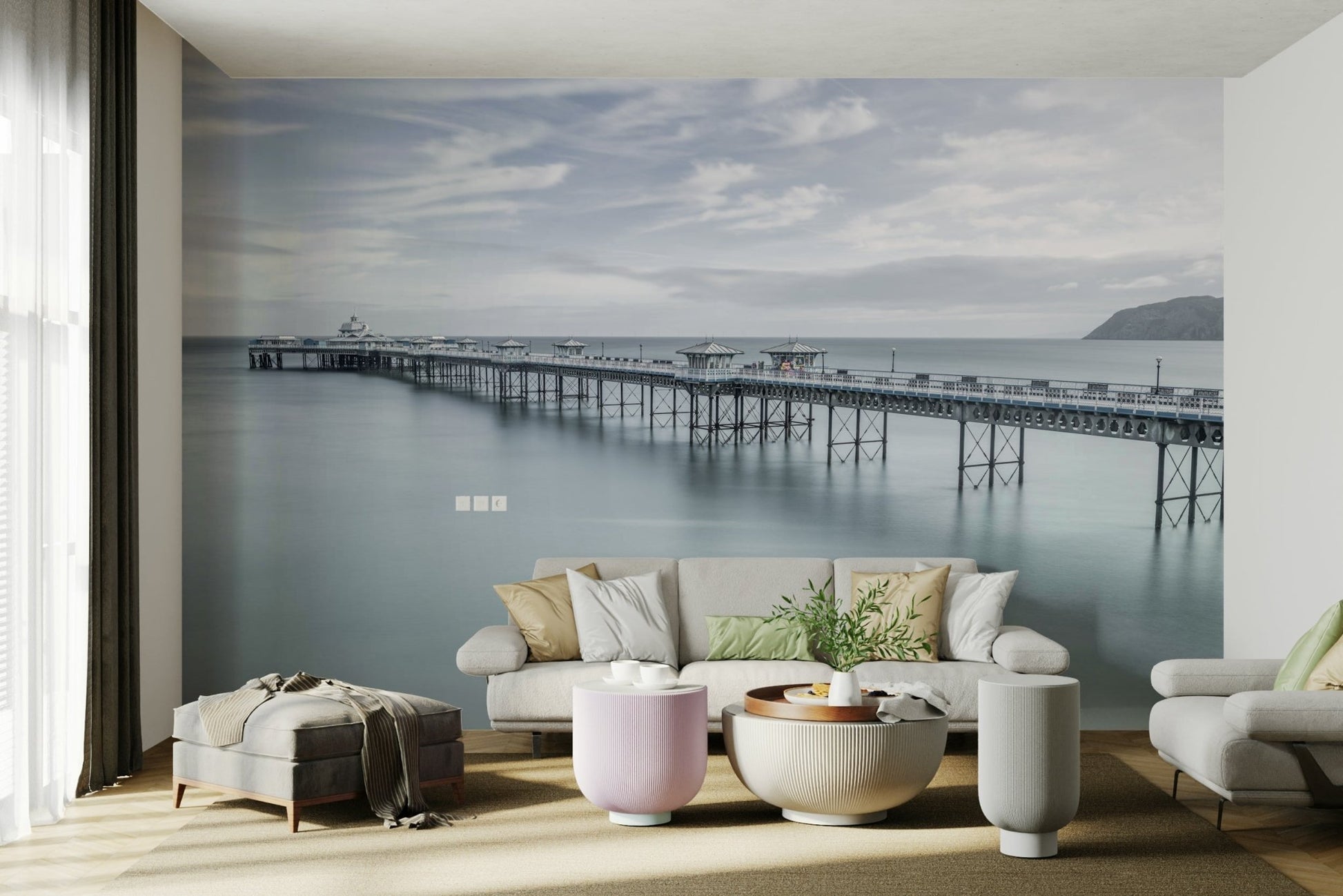 A peaceful wall mural with a long pier stretching into the sea.

