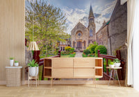 Traditional stone structure in Malmesbury Church Wall Mural with landscaped garden