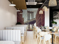 Historic brick buildings framing bridge.

