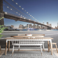 Manhattan bridge wallpaper with illuminated city skyline.