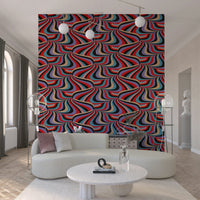 Marble Swirl Groovy Retro Abstract Stripes Colorful Wallpaper accent wall behind a velvet chair.