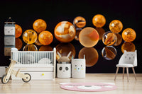 Wallpaper showing marbles on glossy black surface
