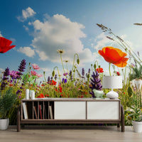 A full-wall mural of a serene meadow landscape.
