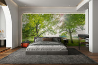 A peaceful wall mural with a meadow scene.


