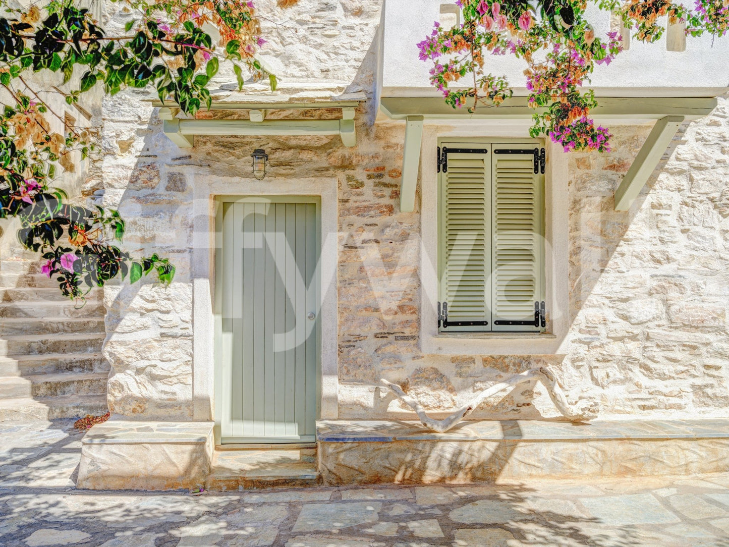 Mediterranean Doorway Charm Wall Mural with stone facade, pale door, and blooms, GD8891